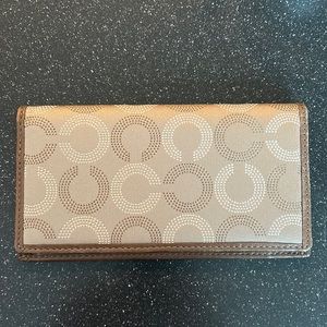 Brown and tan coach checkbook cover